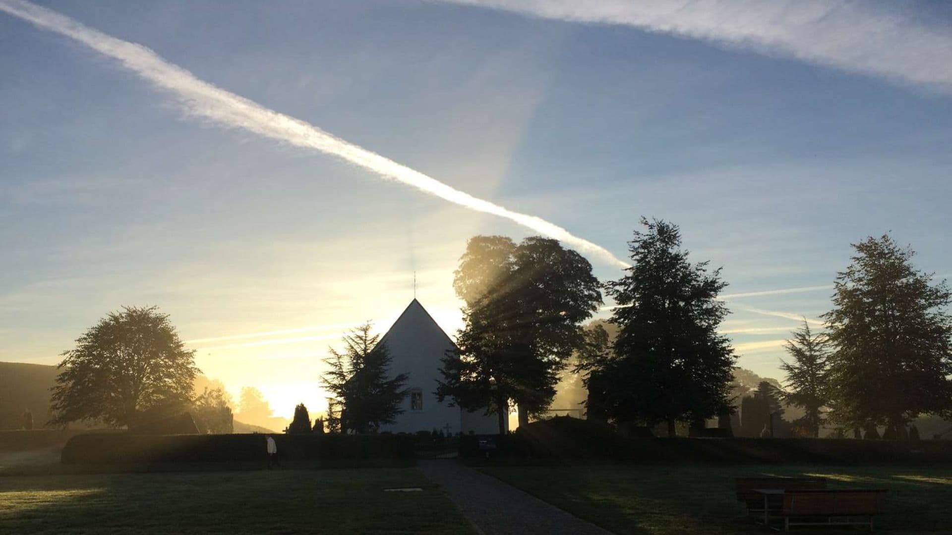 Solopgang over Jelling Kirke
